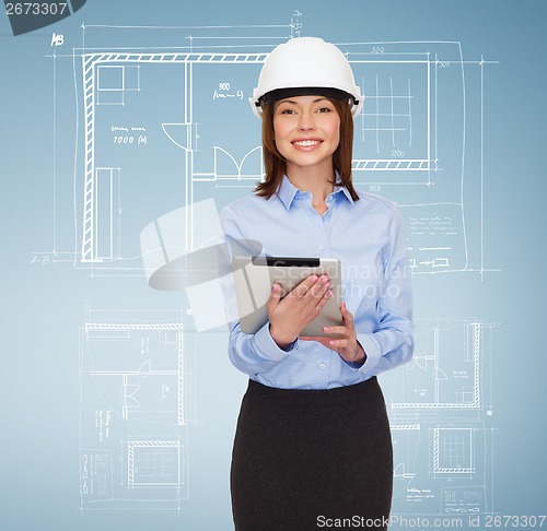 Image of young smiling businesswoman in white helmet