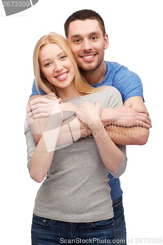 Image of smiling couple hugging