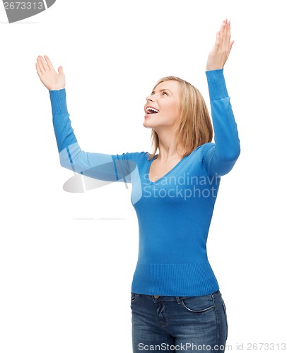 Image of laughing young woman waving hands