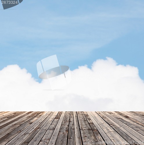 Image of wooden floor and blue sky