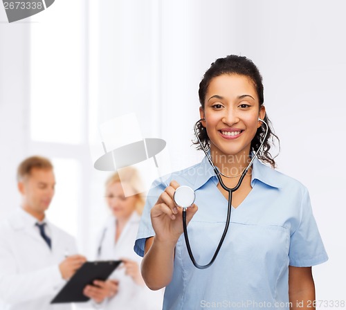 Image of smiling female african american doctor or nurse