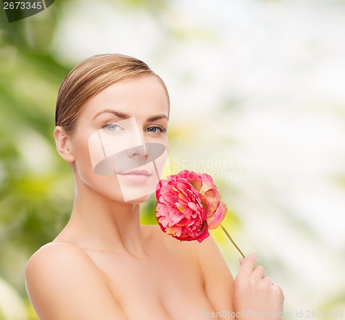 Image of lovely woman with peonie flower