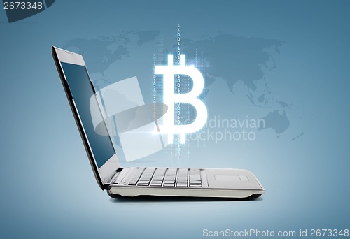 Image of laptop computer with bitcoin