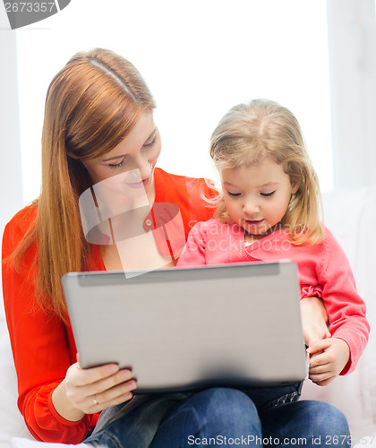 Image of happy mother and daughter with laptop computer