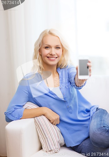 Image of smiling woman with blank smartphone screen at home