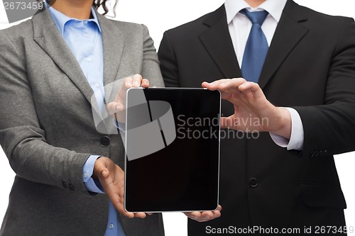 Image of businessman and businesswoman with tablet pc