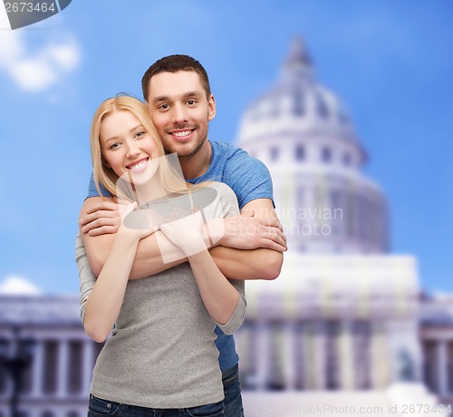 Image of smiling couple hugging
