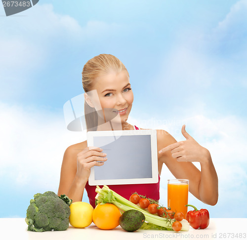 Image of woman with fruits, vegetables and tablet pc