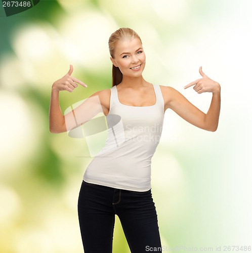 Image of woman in blank white t-shirt pointing at herself