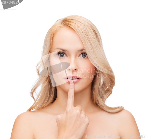 Image of woman touching her lips