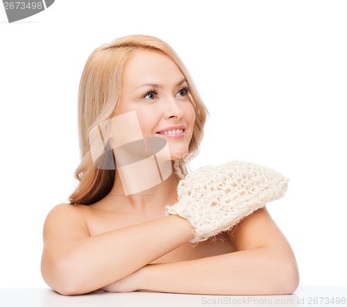 Image of smiling woman with exfoliation glove