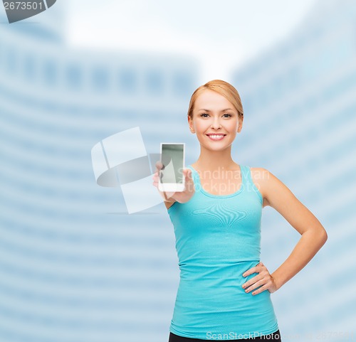 Image of sporty woman with smartphone