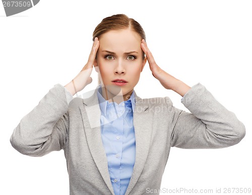 Image of stressed businesswoman having headache