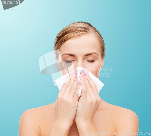 Image of beautiful woman with paper tissue