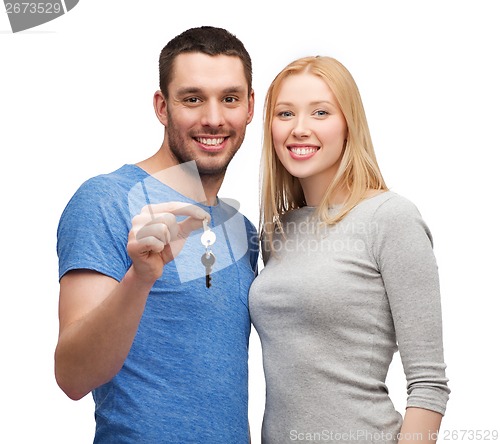 Image of smiling couple holding keys