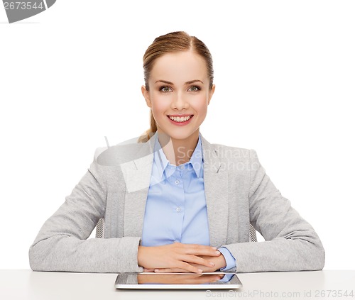 Image of smiling businesswoman with tablet pc