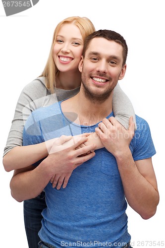 Image of smiling couple hugging