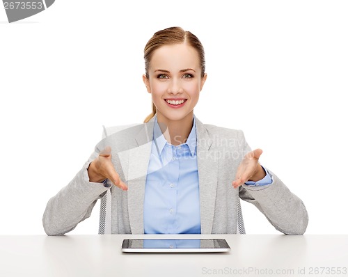 Image of smiling businesswoman with tablet pc