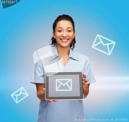 Image of smiling female doctor or nurse with tablet pc