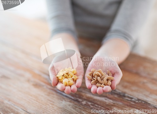 Image of female hands with different pasta variations