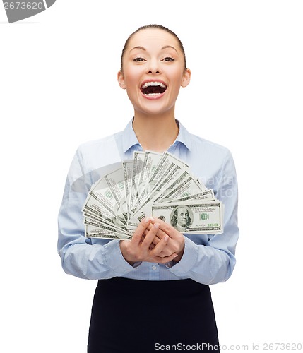 Image of young businesswoman with dollar cash money