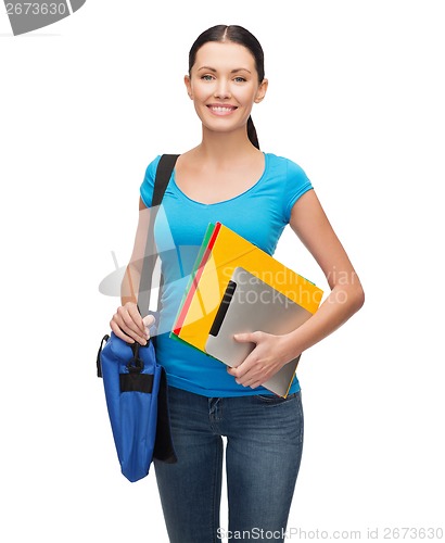 Image of smiling student with bag, folders and tablet pc