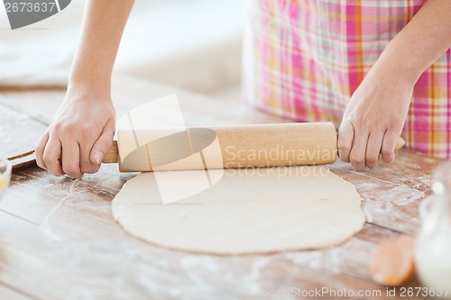 Image of close up of female working with rolling-pin