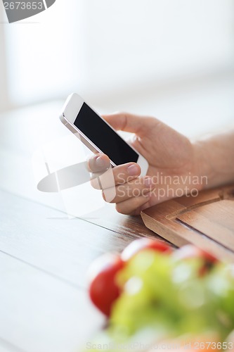 Image of closeup of man with smartphone