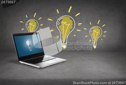 Image of laptop computer with light bulb on screen