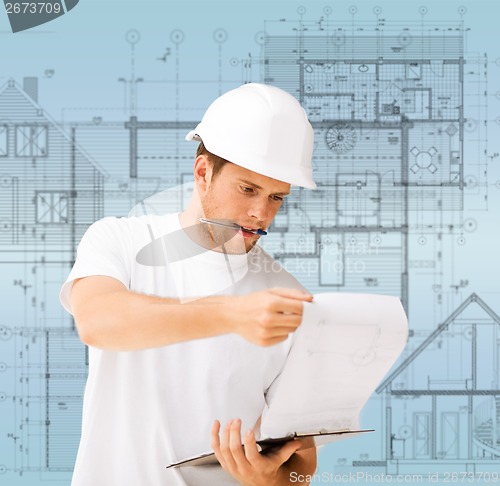 Image of male architect looking at blueprint