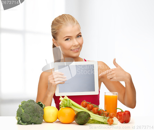 Image of woman with fruits, vegetables and tablet pc