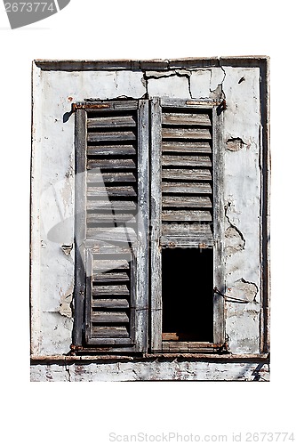 Image of window with old wood shutters 