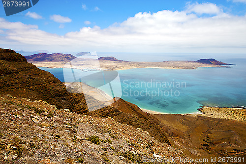 Image of miramar del rio harbor rock   yacht water  in lanzarote spain  