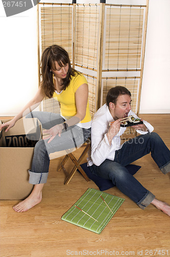 Image of happy couple in new place