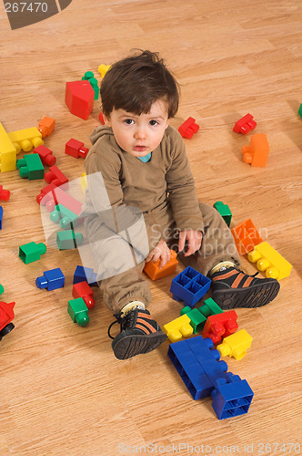 Image of baby playing in empty room