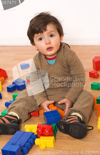 Image of baby playing in empty room