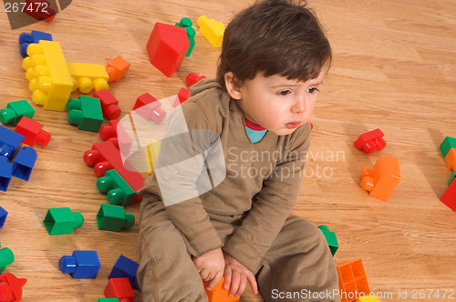 Image of baby playing in empty room