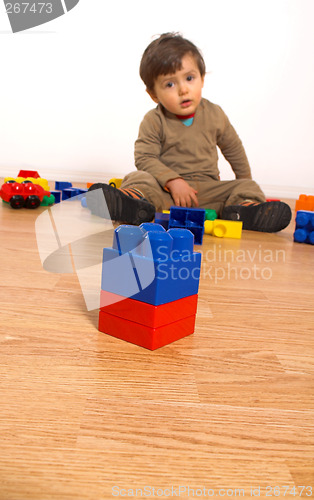 Image of baby playing in empty room