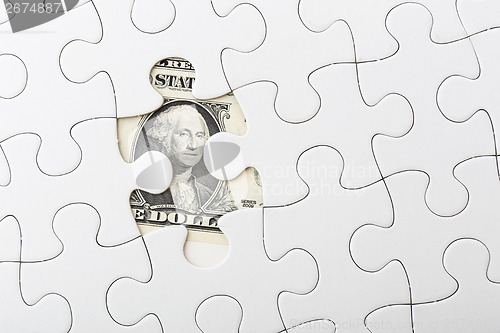 Image of White puzzle with USD