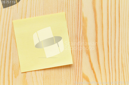 Image of Memo with wooden background