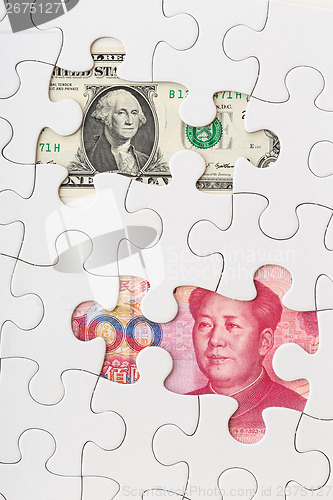 Image of US and Chinese currency as part of puzzle 