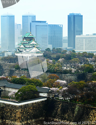 Image of Osaka castle with modern building background