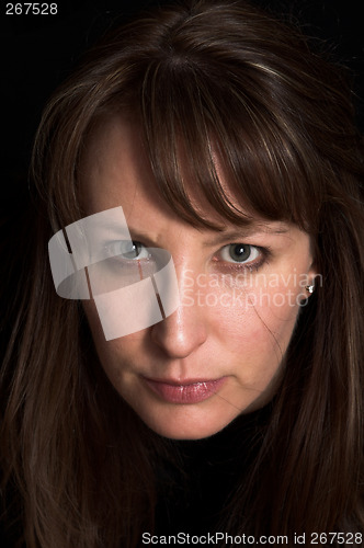 Image of woman portrait on black backdrop