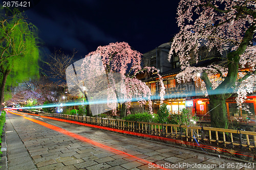 Image of Gion in Kyoto with traffic trail and sakura tree