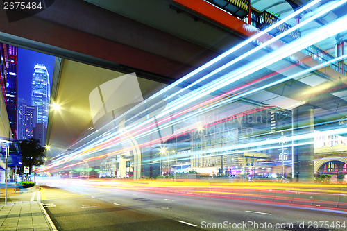 Image of Traffic car light on roadway in city