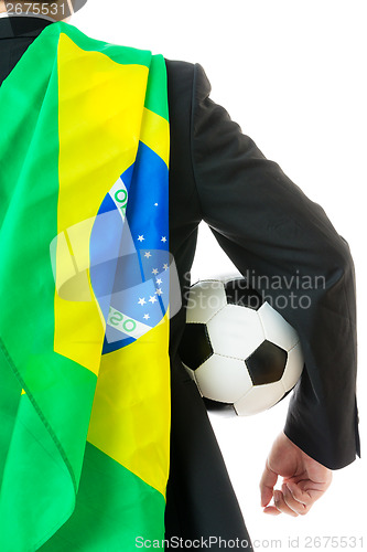 Image of Back view of businessman with soccer ball and Brazil flag