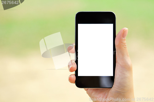 Image of Blank screen mobile phone with woman hand