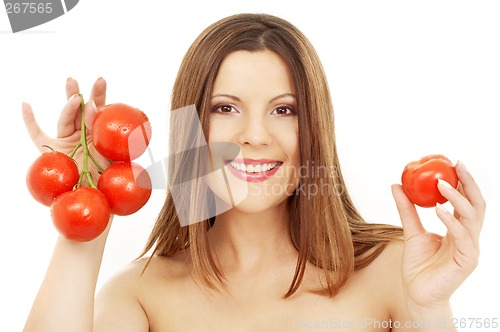 Image of beautiful brunette girl holding tomatos