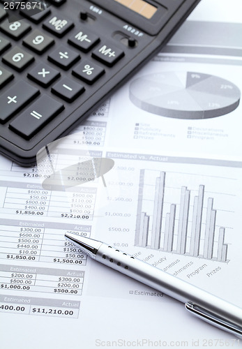 Image of Data graph with calculator and pen