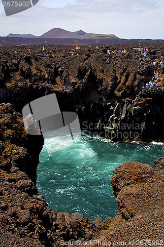 Image of people     lanzarote los hervideros sky cloud beach  and summer 